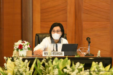 Finance Minister Sri Mulyani Indrawati briefs reporters about a tax break for new cars and homes on March 1.