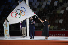 Tokyo douses Olympic flame closing pandemic Games