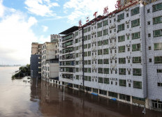 This photo taken on July 11, 2021 shows a street outside a building flooded after heavy rains in Dazhou, in China's southwestern Sichuan province. 
