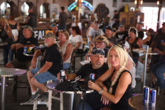 Bikers hang out at the Big Engine Bar at the Sturgis Buffalo Chip campground on August 09, 2021 near Sturgis, South Dakota.
