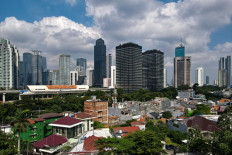 Blue sky is seen above the usually polluted Jakarta on July 2, 2021, after several days of residents restricting themselves from leaving their homes for fear of contracting the delta variant of the COVID-19 coronavirus and a day before the implementation of emergency restrictions on community activities from July 3 to 20.