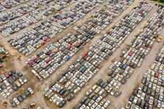 This aerial photo taken on August 10, 2021 shows vehicles damaged by floods in July at a parking lot, some of which will be discarded, in Zhengzhou in China's central Henan province.
