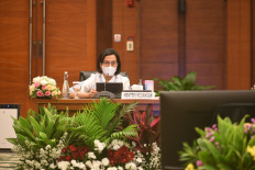 Finance Minister Sri Mulyani updates reporters on state budget planning during a press conference at the Finance Ministry on Aug. 18.