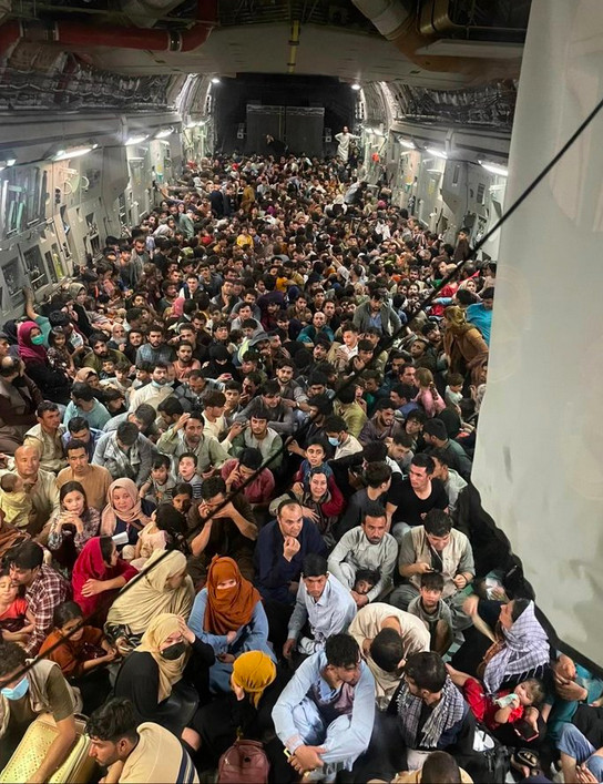 The now-viral image, obtained and posted by the respected military news site Defense One, shows Afghans sitting inside a US Air Force C-17 transport.