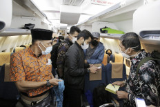 In this photo from the Foreign Ministry, evacuees stand in the cabin of an Indonesian Air Force aircraft on an evacuation flight from Kabul, Afghanistan on Aug. 21, 2021. The Indonesian government has successfully evacuated 26 Indonesians, five Filipinos and two Afghan nationals. 