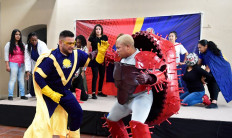 Captain Empath played by Nathaniel Chavez, fights the Covid-19 virus, played by Kenneth Artry during a superhero-themed Covid-19 play at the El Sol Neighborhood Educational Center on August 19, 2021 in San Bernardino, California.