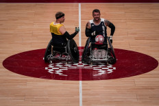 Wheelchair rugby players from Britain attend a training session at Yoyogi National Stadium in Tokyo ahead of the Tokyo 2020 Paralympic Games on August 22, 2021.