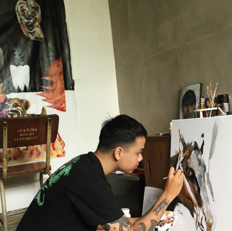 In the zone: Andre Yoga in his Denpasar studio in Bali.
