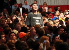 Rochester, Minnesota resident Igor Vovkovinskiy, 27, watches as President Barack Obama arrives to speak on health care during a rally at the Target Center on September 12, 2009 in Minneapolis, Minnesota.