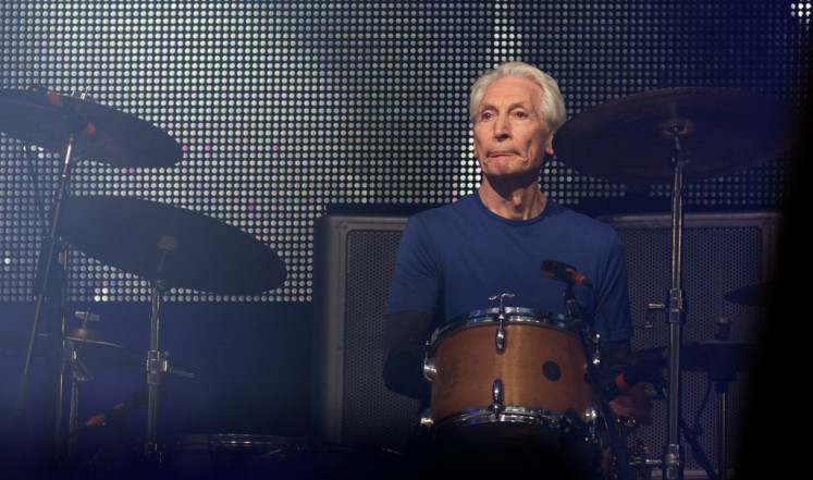 In this file photo taken on June 29, 2013 British musician Charlie Watts of the Rolling Stones performs on the Pyramid Stage on the fourth day of the Glastonbury Festival of Contemporary Performing Arts near Glastonbury, southwest England.