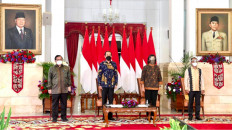 President Joko "Jokowi" Widodo delivers his keynote speech at the 100 Economists event in Jakarta on Aug. 26, 2021.