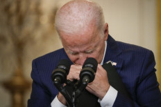 US President Joe Biden pauses while listening to a question from a reporter about the situation in Afghanistan in the East Room of the White House on August 26, 2021 in Washington, DC. At least 12 American service members were killed on Thursday by suicide bomb attacks near the Hamid Karzai International Airport in Kabul, Afghanistan. 