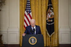 US President Joe Biden pauses while he speaks about the situation in Afghanistan in the East Room of the White House on August 26, 2021 in Washington, DC. At least 12 American service members were killed on Thursday by suicide bomb attacks near the Hamid Karzai International Airport in Kabul, Afghanistan. 