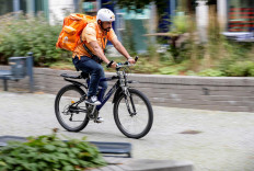 Former Afghan Communication Minister Sayed Sadaat rides a bicycle for his food delivery service job with Lieferando in Leipzig, Germany, August 26, 2021. 
