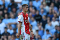 Arsenal's Swiss midfielder Granit Xhaka walks off after being shown the red card during the English Premier League football match between Manchester City and Arsenal at the Etihad Stadium in Manchester, north west England, on August 28, 2021.
