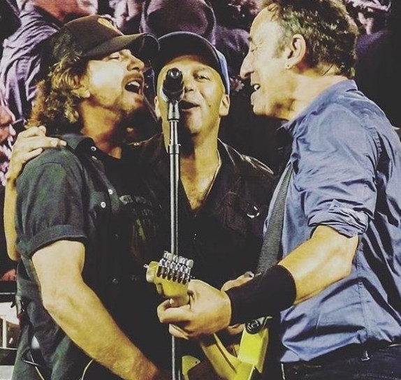 R&R history: Tom Morello (center) performs with Pearl Jam's Eddie Vedder (left) and Bruce Springsteen. The trio made rock and roll history when their separate tour schedules in 2014 brought them together for an impromptu cover of AC/DC's 