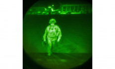 In this handout image courtesy of the US Central Command Public Affairs, Major General Chris Donahue, commander of the US Army 82nd Airborne Division, XVIII Airborne Corps, boards a C-17 cargo plane at the Hamid Karzai International Airport in Kabul, Afghanistan on August 30, 2021. Maj. Gen. Donahue is the final American service member to depart Afghanistan; his departure closes the US mission to evacuate American citizens, Afghan Special Immigrant Visa applicants, and vulnerable Afghans.