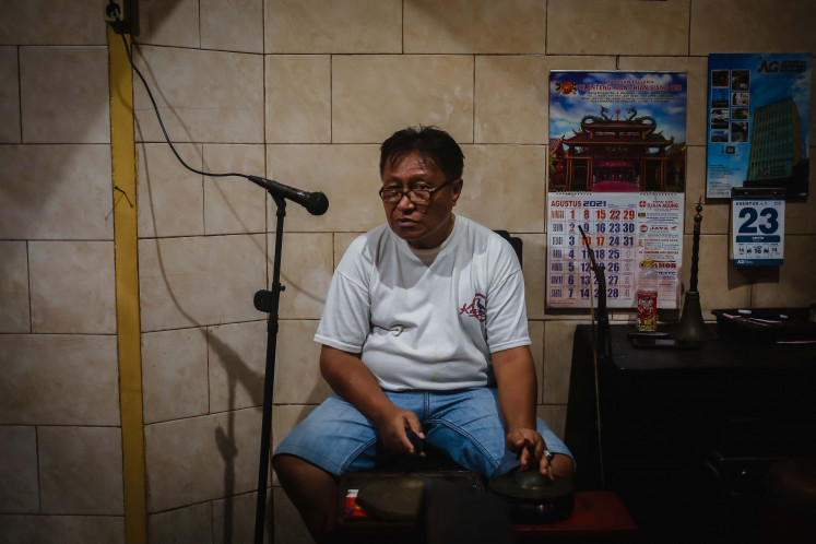 Lifelong artistry: Sukarmujiono has been a 'wayang potehi' puppeteer for more than two decades. He also heads the resident wayang potehi troupe at Hong Tiek Han Temple in Surabaya, East Java, which was founded by his master, Gan Cao Cao.