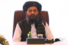 In this file photo taken on July 18, 2021, the leader of the Taliban negotiating team, Mullah Abdul Ghani Baradar looks on at the final declaration of the peace talks between the Afghan government and the Taliban presented in Qatar's capital Doha.