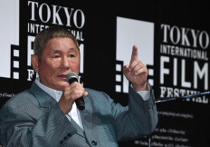 Japanese movie director Takeshi Kitano gestures as he answers questions after winning the first Samurai Award of the Tokyo International Film Festival during an event with young Japanese filmmakers in Tokyo on October 25, 2014.
