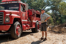 Randy Dunn of Dunn Vineyards looks over a 1982 fire truck he purchased to protect his property from wildfires in Angwin, California, August 30, 2021.