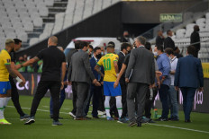 Employees of the National Health Surveillance Agency (Anvisa) entered to the field during the South American qualification football match for the FIFA World Cup Qatar 2022 between Brazil and Argentina at the Neo Quimica Arena, also known as Corinthians Arena, in Sao Paulo, Brazil, on September 5, 2021. Brazil's World Cup qualifying clash between Brazil and Argentina was halted shortly after kick-off on Sunday as controversy over Covid-19 protocols erupted.