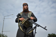 Taliban effect: A Taliban fighter attends a rally in Kabul on Aug. 31 as they celebrate after the United States pulled all its troops out of the country to end a brutal 20-year war. Many have predicted the Taliban’s victory will inspire and embolden extremists to fight for the cause.