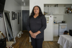 Former 9/11 ground zero cleanup worker Rubiela Arias poses for a photo at her home in the Queens borough of New York on May 27, 2021.