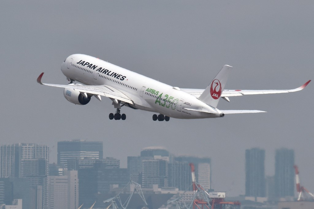 This photo taken on April 28, 2020 shows a passenger jet from Japanese carrier Japan Airlines (JAL) taking off from Tokyo's Haneda airport.