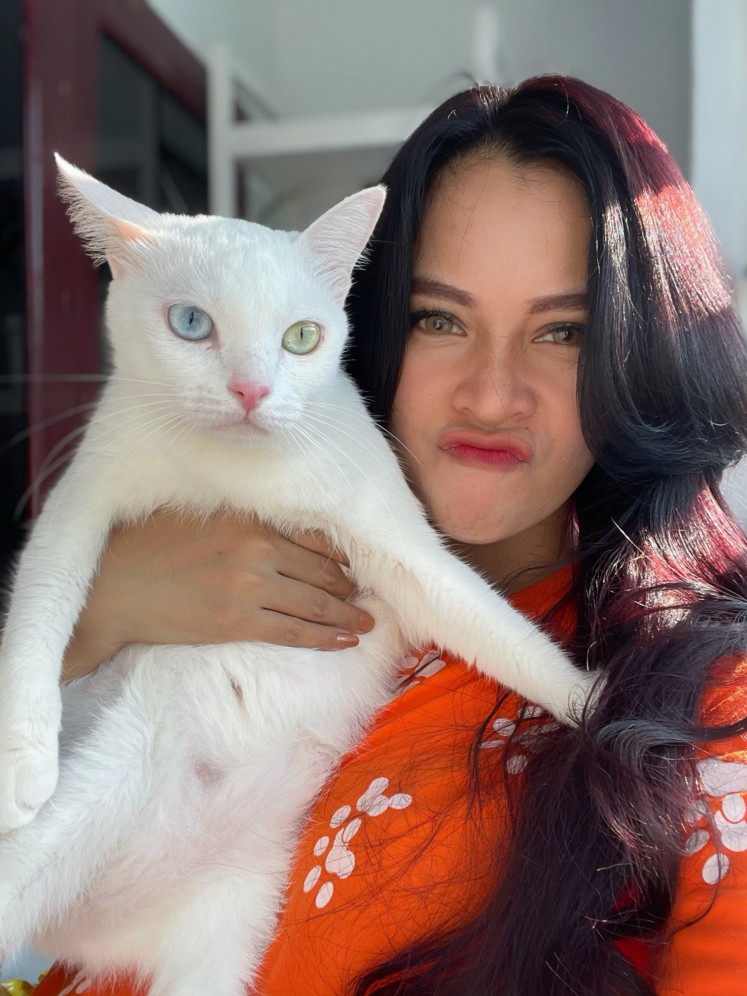 Equally fierce: Cynthia Luriany says her white cat is adorably fierce.