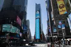 A displays show a message during the commemoration of 20th anniversary of the 9/11 attacks in Times Square in New York on September 11, 2021.