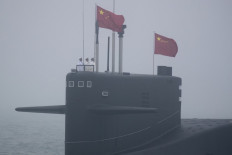 A type 094 Jin-class nuclear submarine Long March 15 of the Chinese People's Liberation Army (PLA) Navy participates in a naval parade to commemorate the 70th anniversary of the founding of China's PLA Navy in the sea near Qingdao, in eastern China's Shandong province on April 23, 2019. China celebrated the 70th anniversary of its navy by showing off its growing fleet in a sea parade featuring a brand new guided-missile destroyer.