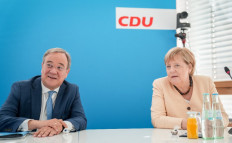 North Rhine-Westphalia's State Premier and the Christian Democratic Union (CDU) candidate for Chancellor Armin Laschet and German Chancellor Angela Merkel talk prior to the party leadership meeting on September 13, 2021 at the CDU's headquatrers in Berlin.
