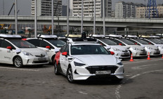 A picture taken on April 15, 2021 shows self-driving cars, developed by Russian internet giant Yandex, at the company's parking lot in Moscow.