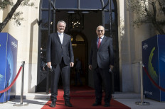Then-Organisation for Economic Co-operation and Development (OECD) Secretary-General Angel Gurria (right) poses with former Australian Finance Minister Mathias Cormann as he arrives for a handover ceremony at the OECD headquarters in Paris on June 1, 2021. Cormann took over as Secretary-General of the OECD after Gurria's 15-year tenure.
