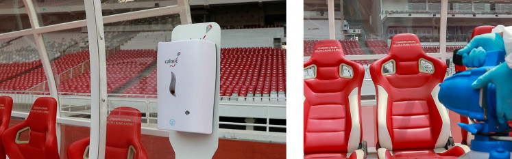 An automatic hand sanitizer dispenser stands near the coach and player bench area (left). Disinfection of the courtside benches (right).