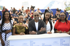 (From L) Chadian actress Briya Gomdigue, Chadian actress Achouackh Abakar Souleymane, Chadian director Mahamat-Saleh Haroun, Chadian actress Rihane Khalil Alio and Chadian actress Hadje Fatime Ngoua pose during a photocall for the film 'Lingui' (The Sacred Bonds) at the 74th edition of the Cannes Film Festival in Cannes, southern France, on July 9, 2021.