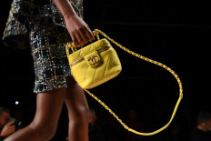 A model presents a creation for Chanel during the Women's Spring-Summer 2022 Ready-to-Wear collection fashion show in Paris, as part of Paris Fashion Week, on October 5, 2021.