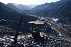 This photo taken on December 11, 2019 shows mining equipment on a mountain of rocks above the Datai coal mine in Mentougou, west of Beijing. Mentougou, one of China's oldest mining towns, has powered the capital for nearly 300 years but more than 270 coal mines in the area have been shut down over the past two decades as China scambles to cut carbon emissions and switch to renewables.