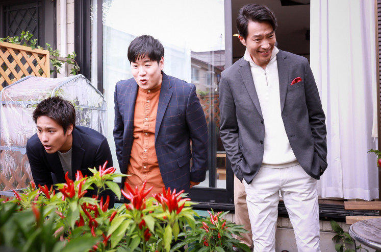 Chili love: Kenta (played by Akito Kiriyama, left), Yuya (played by Kanro Morita, center) and Masato (played by Yasuyuki Maekawa, right) marvel at their chief's home chili garden. Source: the series' official Twitter. (Netflix)
