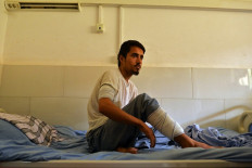 Abbas, who was injured in October 8 suicide bombing at the Gozar-e-Sayed mosque, speaks to AFP inside a regional hospital in Kunduz on October 10, 2021.