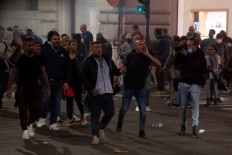 Extreme-right political party Forza Nuova leader Giuliano Castellino (C) shout during clashes following a protest against the mandatory sanitary pass called 'green pass' in the aim to limit the spread of the Covid-19 in central Rome on October 9, 2021.