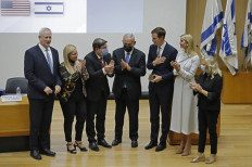 (Left to right) Israeli Defence Minister Benny Gantz, MKs Ruth Wasserman Lande, Ofir Akunis, Israel's Opposition leader and ex-premier Benjamin Netanyahu, US businessman and former Trump-administration presidential advisor Jared Kushner, Daughter and Senior Advisor to the former US President Ivanka Trump, and Sara Netanyahu, applaud during the inaugural event of the Abraham Accords Caucus, at the Knesset (Israel's parliament) in Jerusalem on October 11, 2021. 