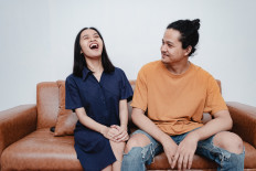 Faith in elders: Ragil Dwi Putri and Fareeq Angkasa trust a community elder to help guide them through life. (Bayu Atha)