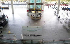 The international arrivals terminal at I Gusti Ngurah Rai International Airport in Denpasar, Bali remains empty on Oct. 14, 2021, the first day of the resort island's reopening to foreign visitors.