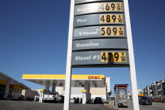 Gasoline prices over $4 a gallon are displayed at a Shell station on Oct. 12, 2021, in San Francisco, California. Oil prices were back testing new multi-year highs on Friday, a drag on growth in energy-importing markets in north Asia, but good news for energy-exporting markets in Southeast Asia.