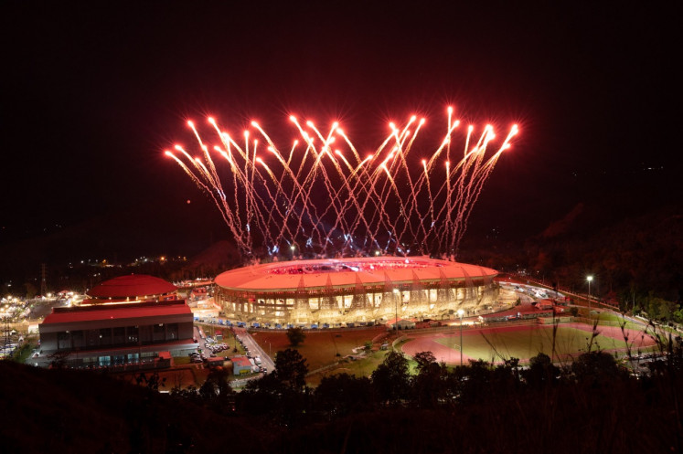 Fireworks are seen during the closing ceremony of the 20th National Games (PON) on October 15, 2021, from outside the Lukas Enembe Stadium, formerly known as Papua Bangkit Stadium, in Jayapura, Papua.