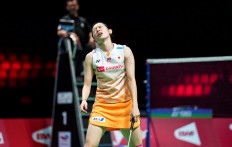 Japan's Sayaka Takahashi reacts as she plays against China' He Bing Jiao during their Uber Cup women's single match in Aarhus, Denmark, on October 16, 2021. 