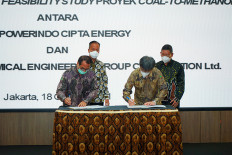 Industry Minister Agus Gumiwang Kartasasmita attends the signing ceremony for an agreement between Powerindo Cipta Energy (PCE) and China National Chemical Engineering Corporation to begin a feasibility study for a $560-million coal-to-methanol plant.