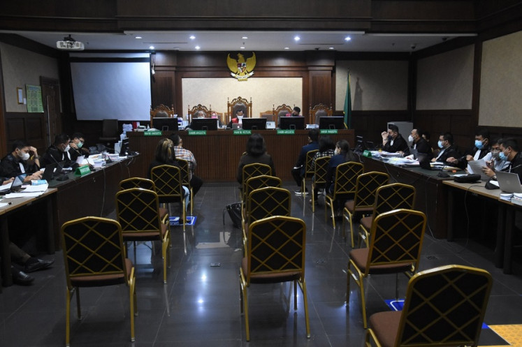 Jakarta Corruption Court judges hear the testimonies of graft case defendants in this undated file photo.